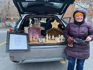 Lady with nativity in trunk of car