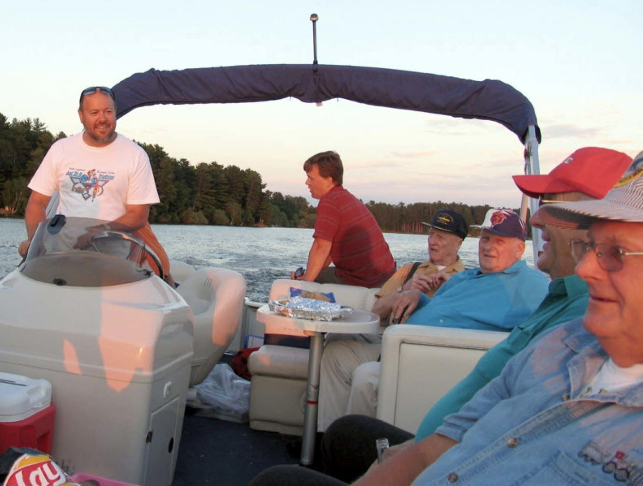 Mark Gass driving a boat for Men's Club