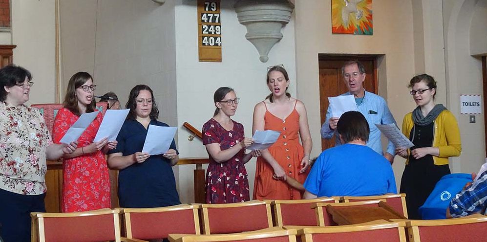 WELS members in London sing at a worship service there
