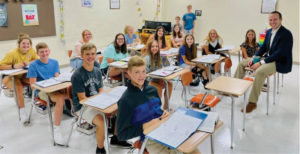 Teens at their desks with teacher SEPT 22