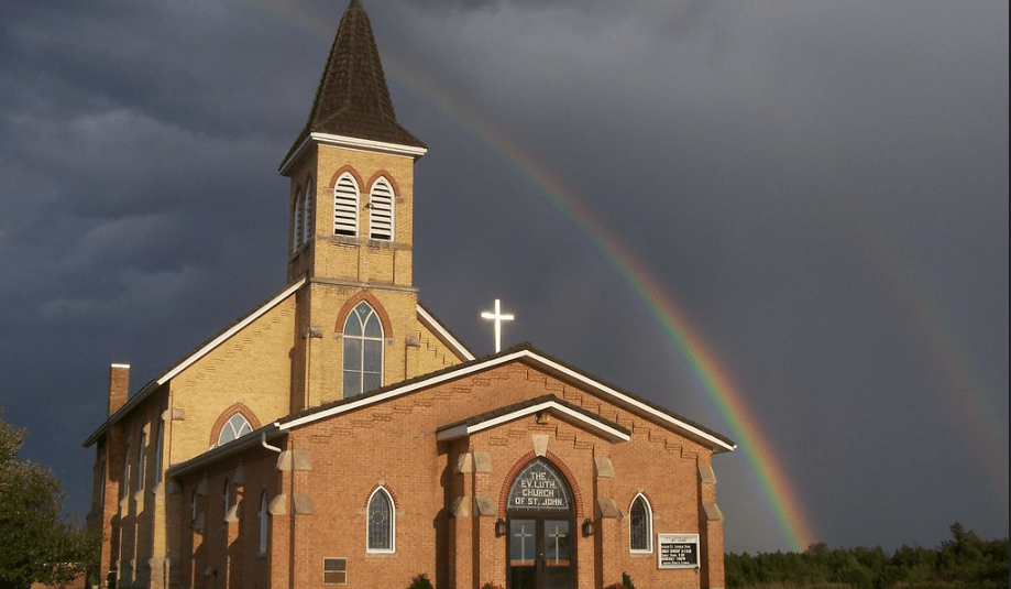 Church with rainbow in the background