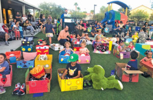 District News drive in movie kids in cardboard boxes decorated