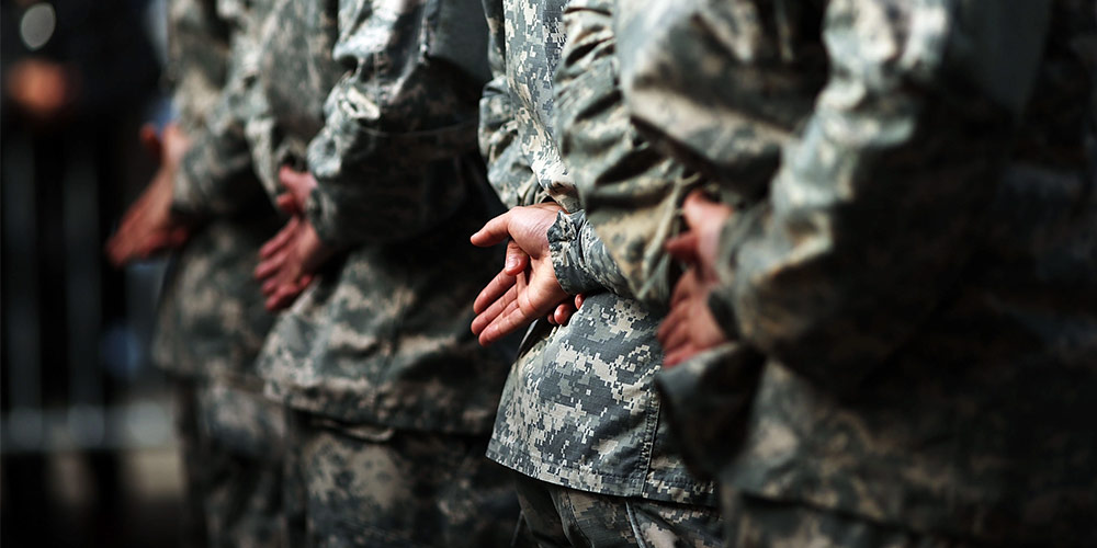 US military personnel standing in line