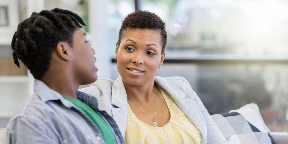 mom and teen son talking