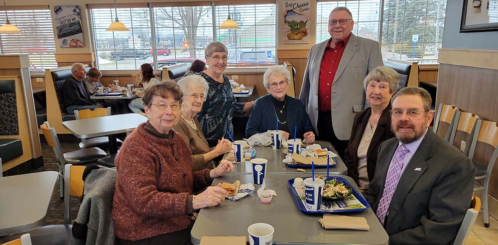 Group of widows and widowers from Faith, Fond du Lac, Wis., eating lunch together at Culver's