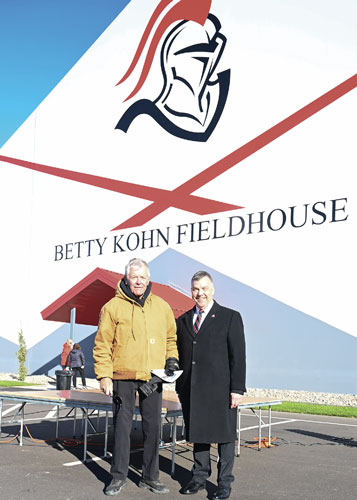 Betty Kohn Fieldhouse with two men