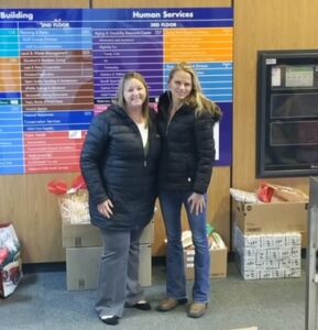 Molly Hubbell (children and family supervisor for Ozaukee County Department of Human Services) and Hilde Miller at the foster children Christmas drive.
