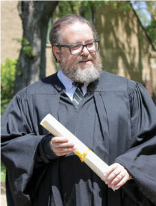 Karl DeMarce at gradutation robe