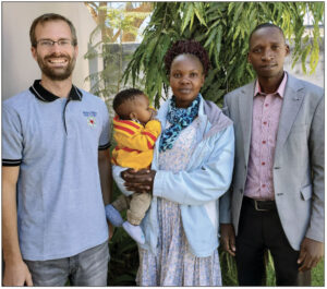 Benjamin Foxen with Makisimu Musa, wife, Mary and son Nathanael Evan, in Zambia, Africa convention