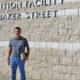 man standing outside detention facility