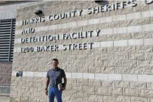 man standing outside detention facility