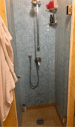 Tiny shower in vacation rental home