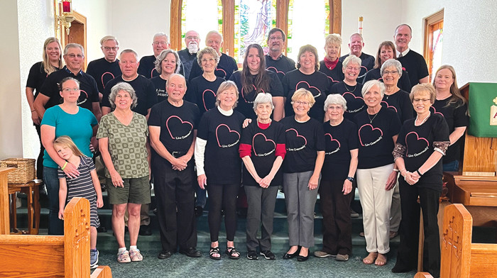 Group of ladies wearing black shirts with hearts on them