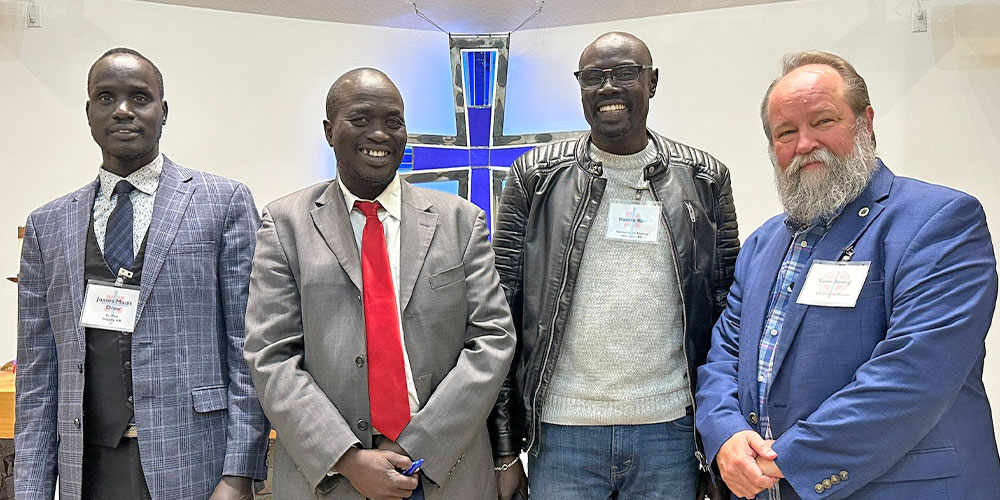 4 men standing in church