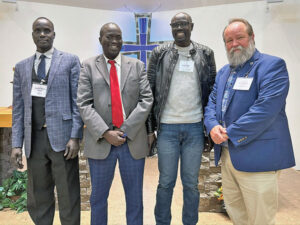 4 men standing in church