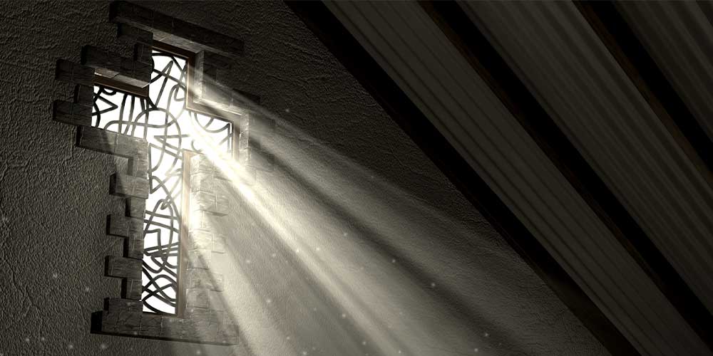 Light shining through a cross