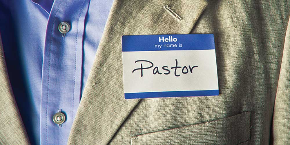 Man's suit coat with a "hello my name is" sticker