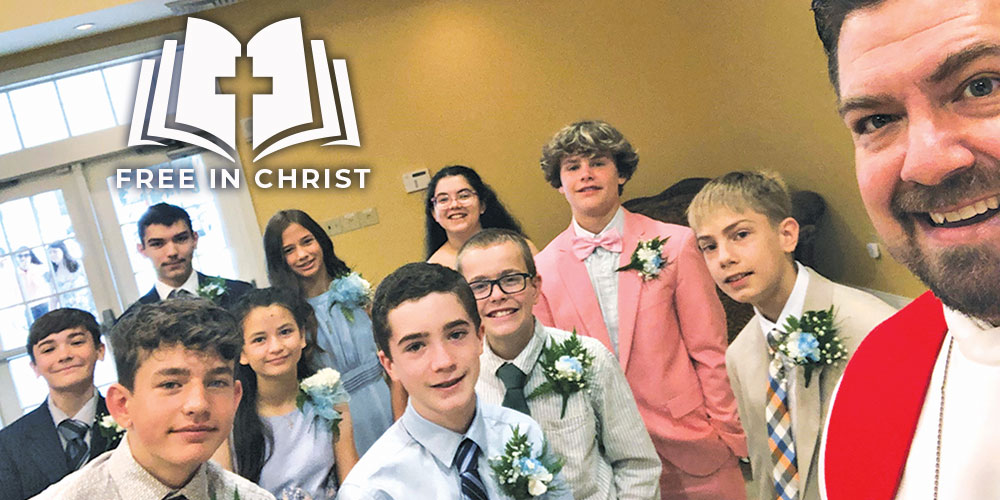 pastor with confirmation students in a selfie