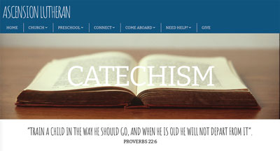 open bible with the word catechism on it