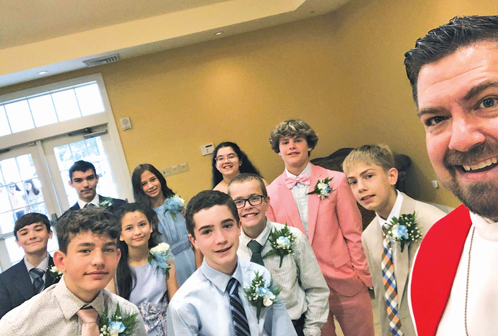 pastor with confirmation students in a selfie