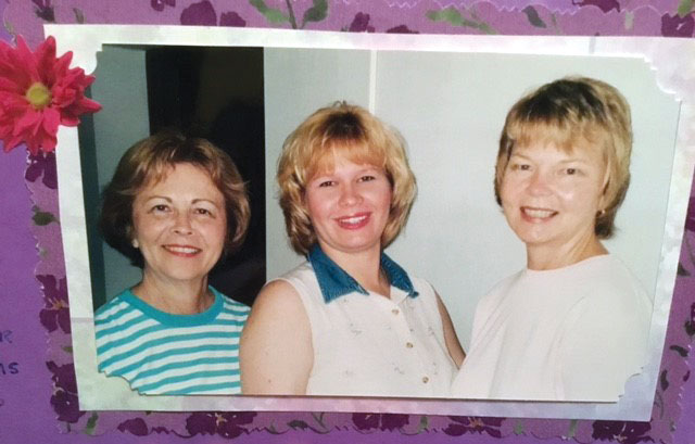 picture of 3 women in a purple frame