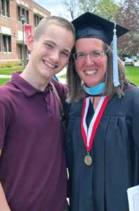 woman graduation with son