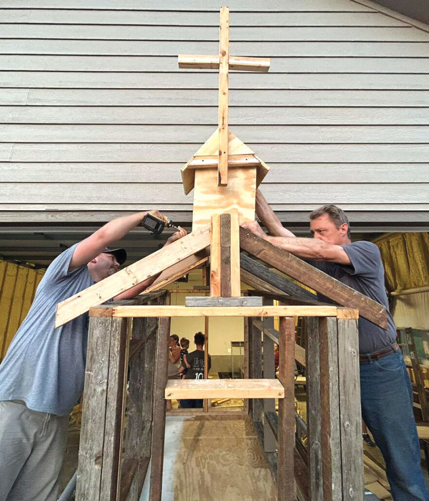 two men making a steeple