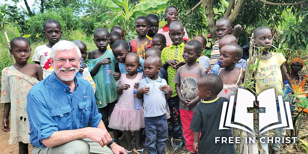 Mark Schulz interacting with children after church in Uganda in 2023