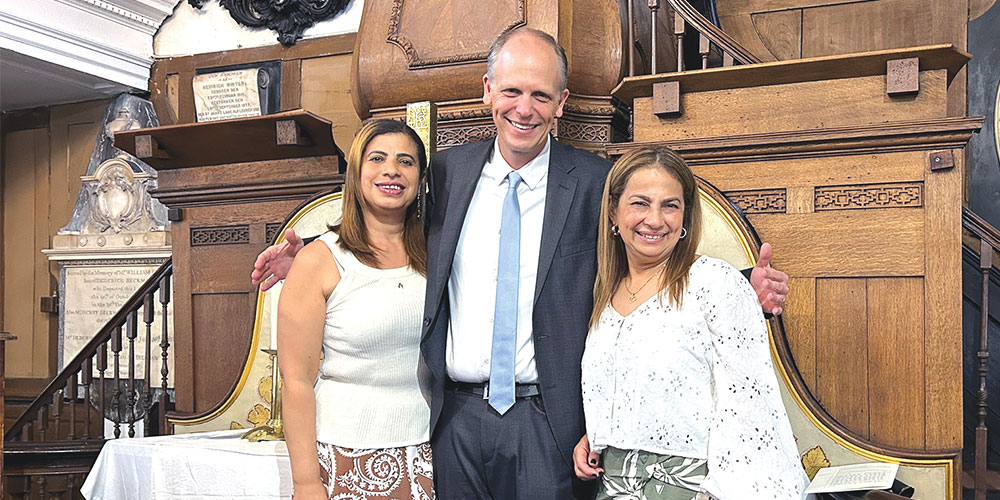 Sisters Martha (left) and Dora with Missionary Mike Hartman at St. George Lutheran Church in London.