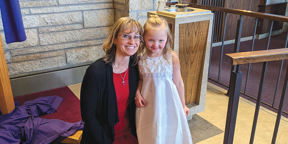 June Keller teacher and student Aurora at Aurora’s baptism.