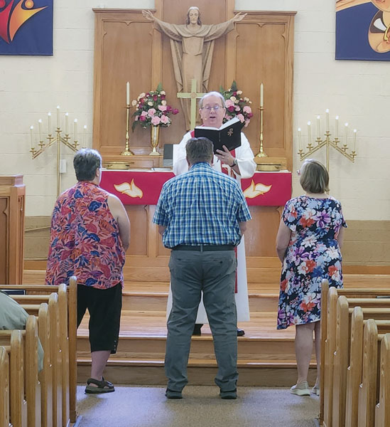 Chesaning Teacher Installation. two women and a man