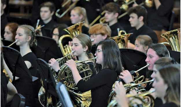 students playing tuba and horn wearing black