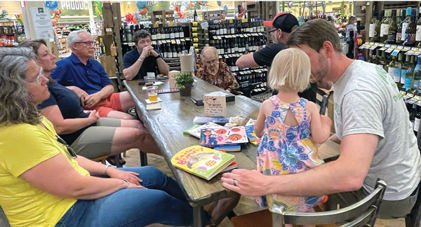 people having a meeting in store