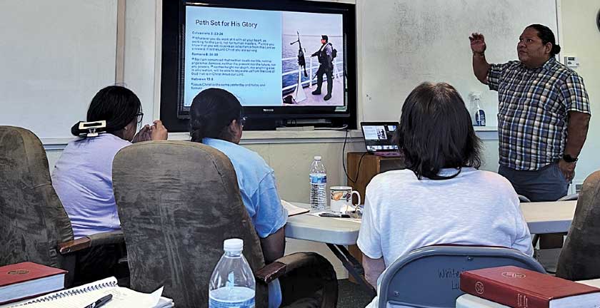 Man standing and teaching class