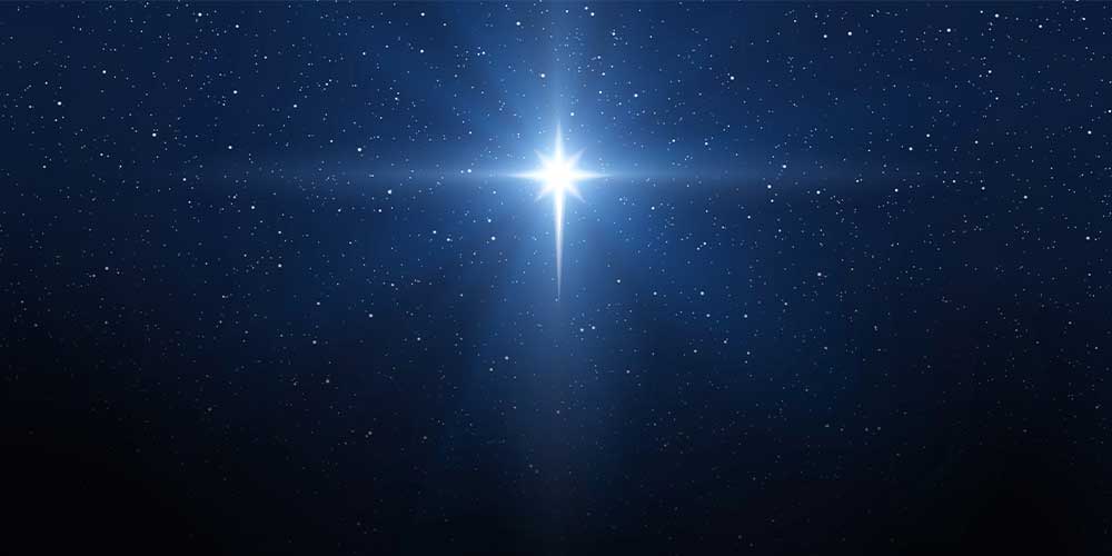 Dark sky with stars and one big bright star