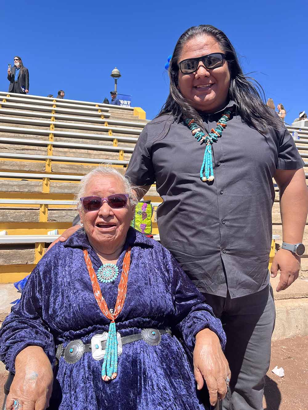Aaron Newman and an older woman, both wearing Navajo jewelry
