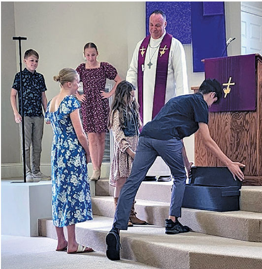 Alleluia rolled up pastor and kids in church