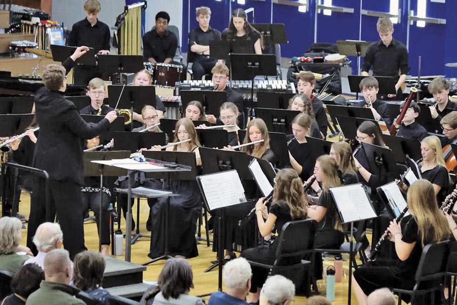 teens in black playing in a band