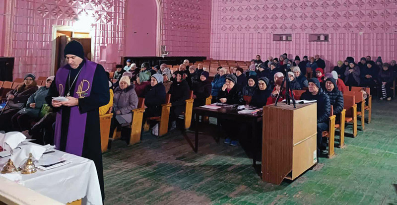 church service with pink walls and green flooring