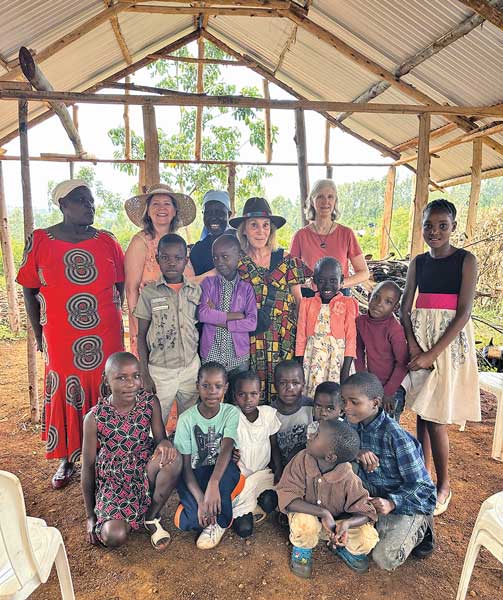 mission trip with natives and children. red dress