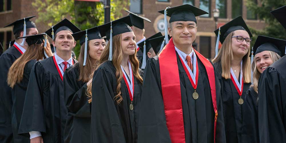 MLC graduates in line ready to walk in