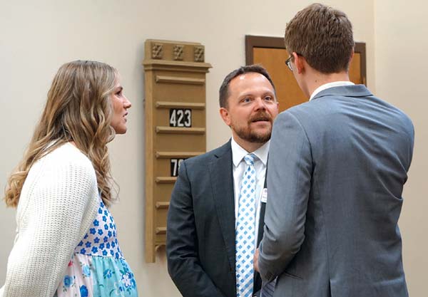 Michael Seifert, Joshua Wordell and his wife having a talk white tie with diamonds