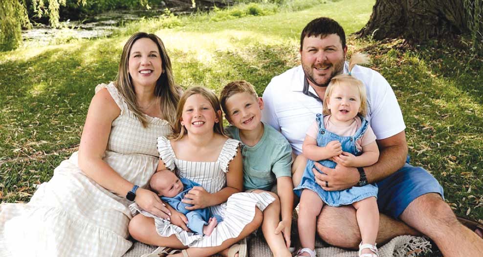 Alyssa and Casey Schwartz and children outside