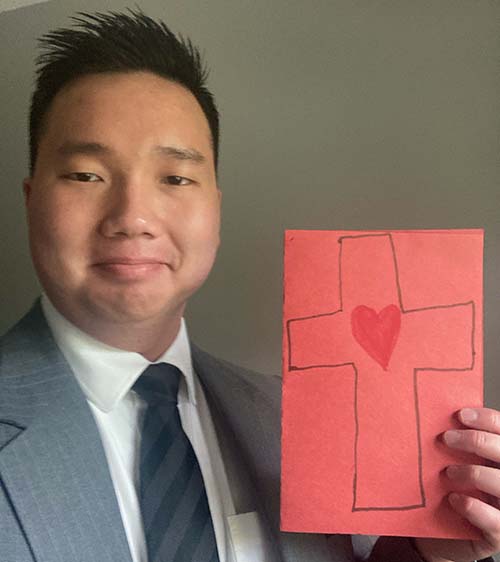 Ronny Nguyen with encouraging card from young student upon his graduation from the seminary