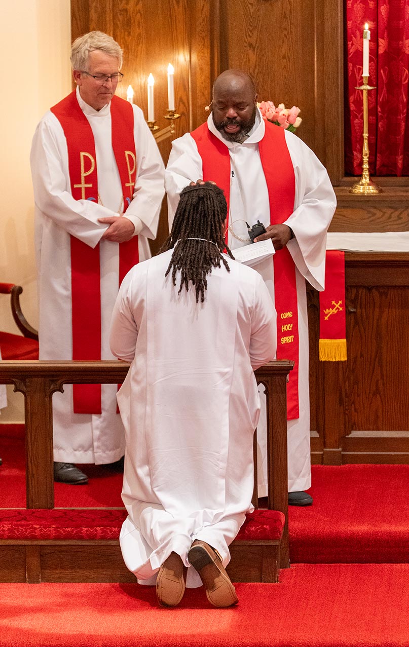 Aaron Robinson blessing Keri Jackson during Jackson's ordination