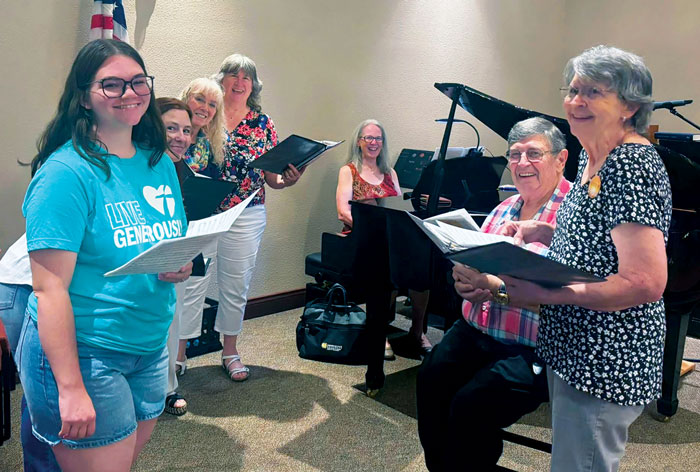 choir signing with piano in background