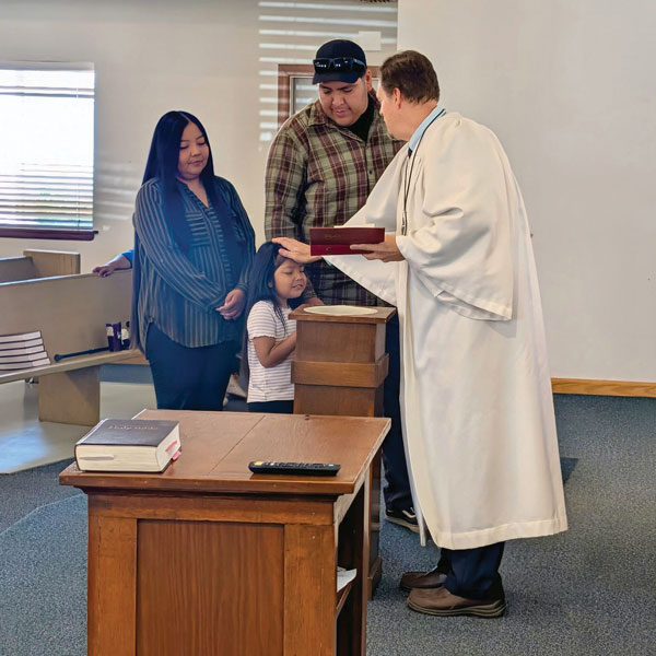 pastor blessing a child
