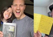 Image of men holding up homemade cards