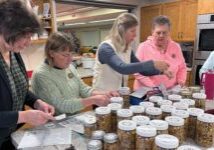 women making trail mix for homebound