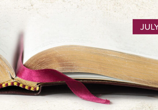 open bible with gold on edges of paper and burgandy ribbon